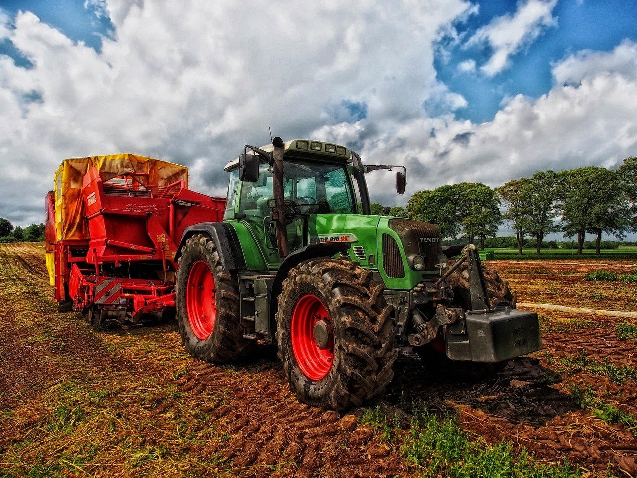 Modern agricultural machinery working in British countryside