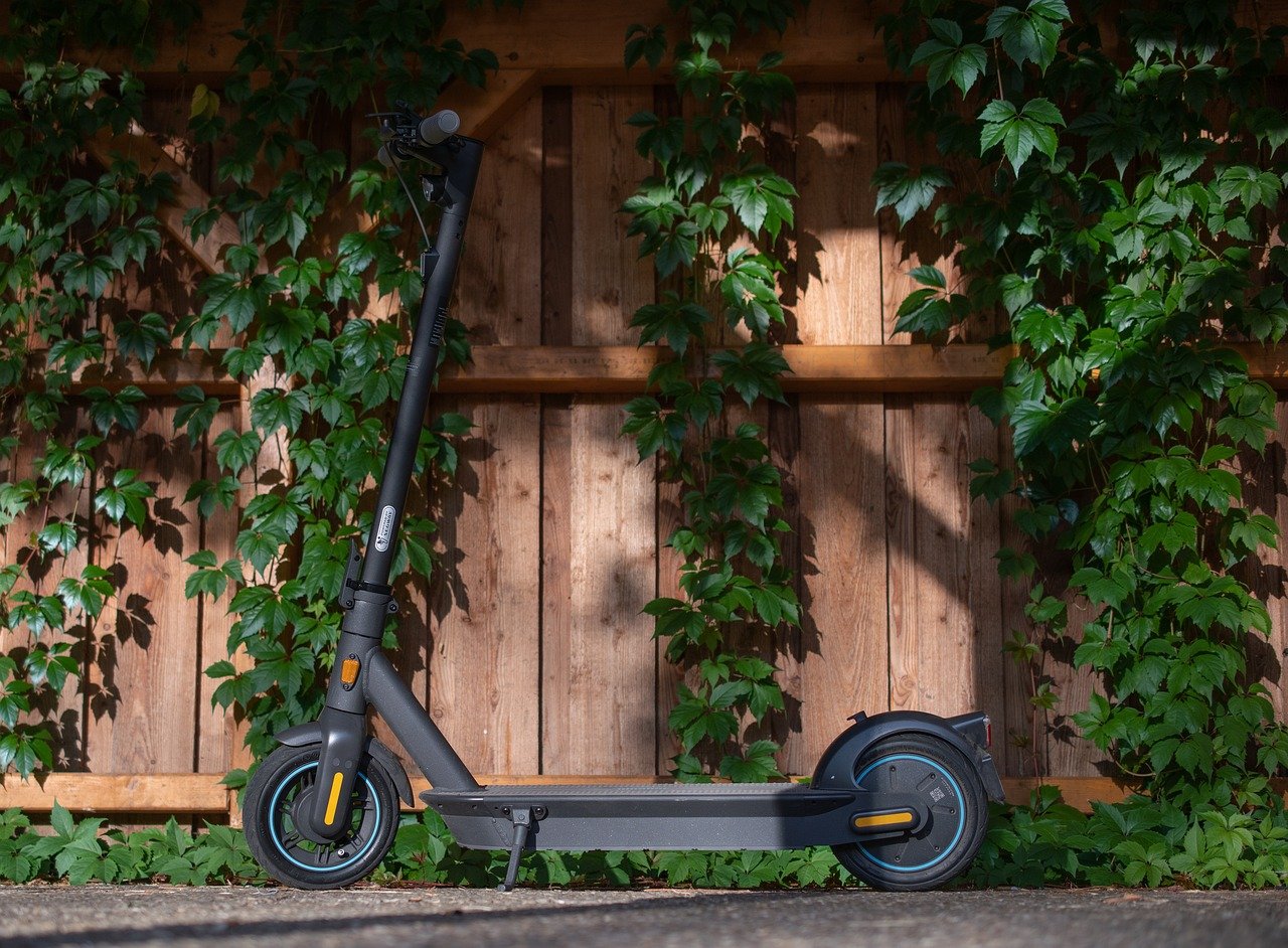 E-scooters parked near a public transport stop in a modern city